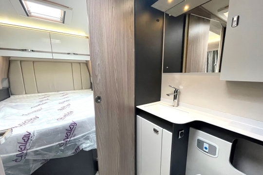 swift-voyager-594-interior-bathroom-to-bed.jpg
