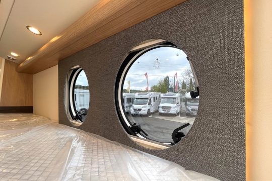malibu-van-first-class-180-interior-portholes-looking-out.jpg