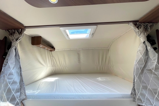 carthago-e-line-i-50-le-da-interior-over-cab-bed.jpg