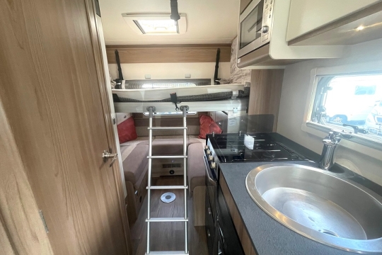 swift-champagne-c404-interior-drop-down-bed.jpg