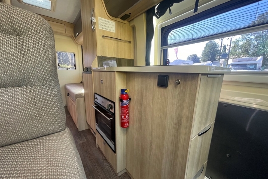auto-trail-tribute-670-interior-kitchen-to-rear.jpg