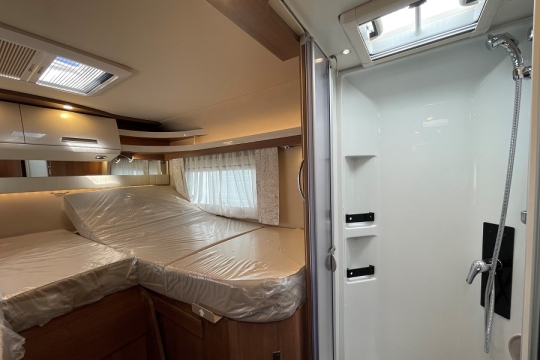 carthago-c2-tourer-i-145-rb-le-interior-bed-with-shower.jpg