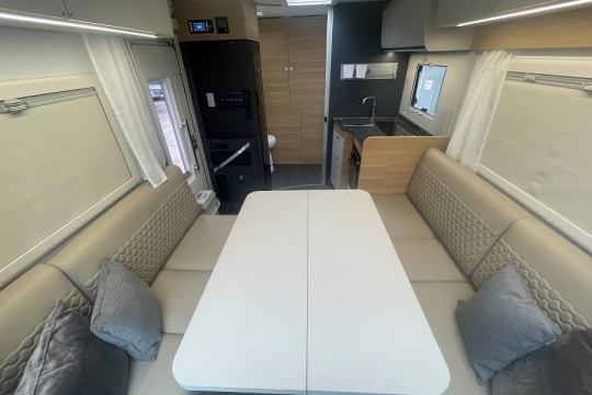 adria-matrix-axess-600dt-interior-front-lounge-to-rear.jpg