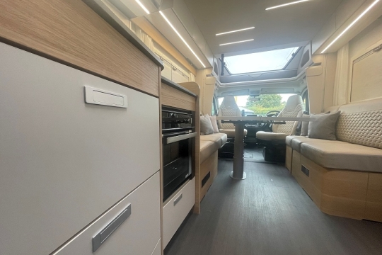 adria-matrix-axess-600dt-interior-kitchen-to-lounge.jpg