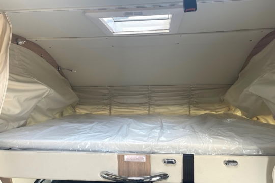 laika-ecovip-interior-overcab-bed-2.jpg